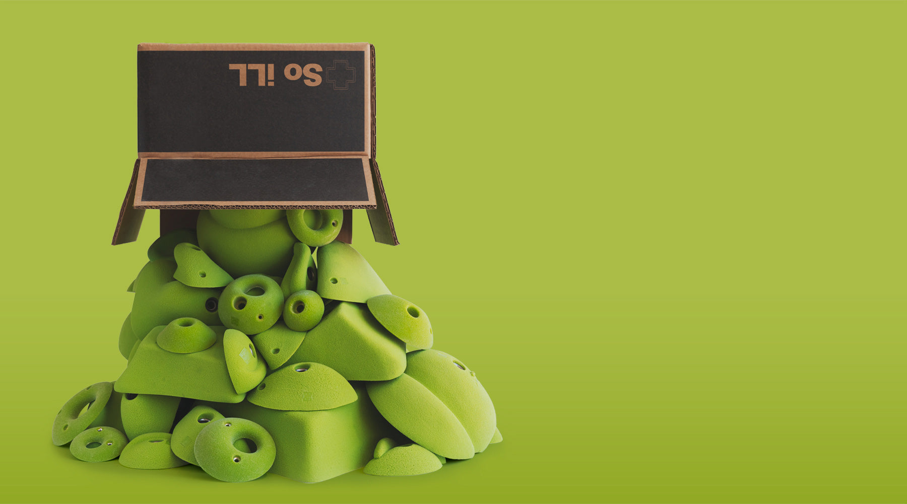 a box sits on top of a stack of climbing holds