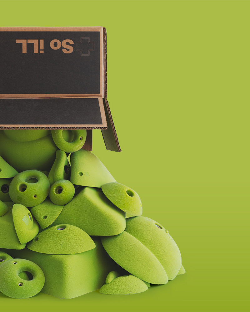 a box sits on top of a stack of climbing holds